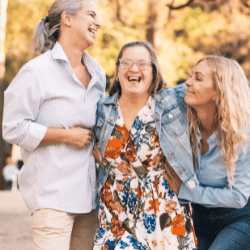 Disabled woman laughing with two friends