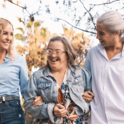 Disabled woman laughing with two friends