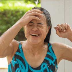 Happy girl in bathers laughing