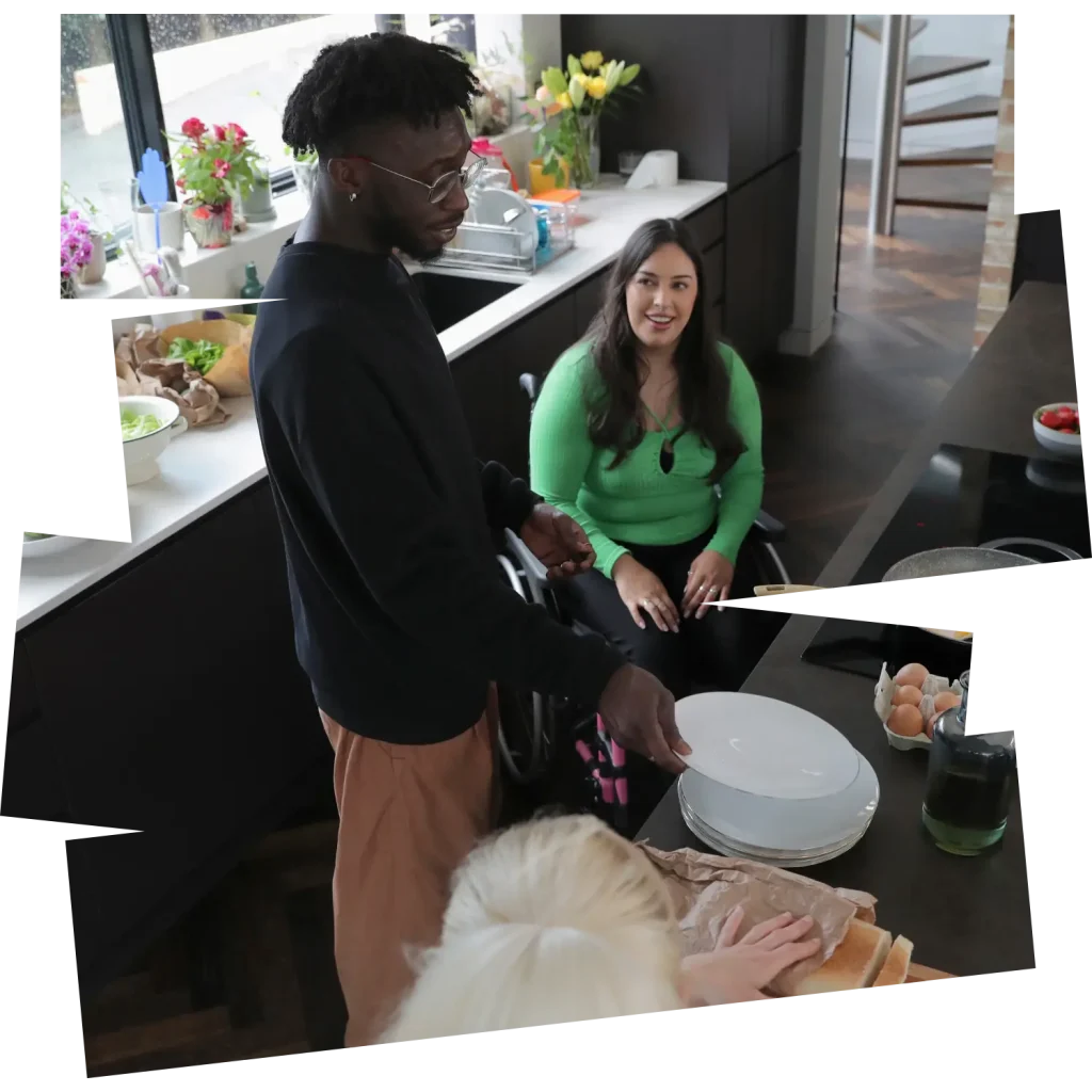 Disabled woman in wheelchair sitting in kitchen with friends