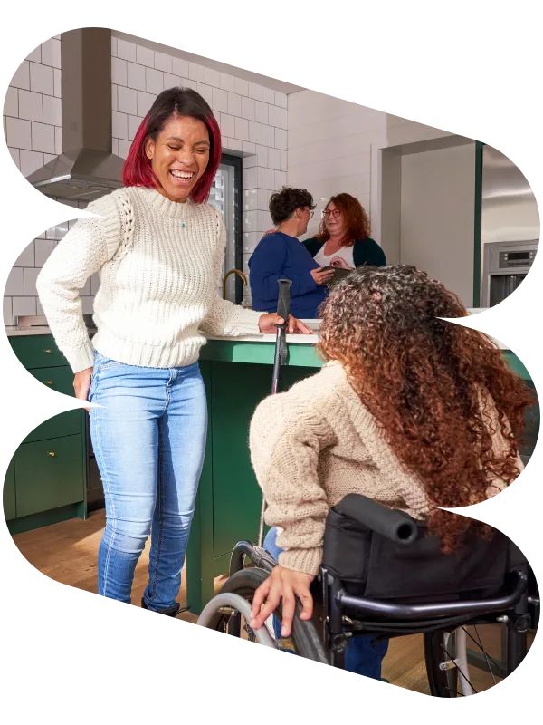 Support worker talking with woman in wheelchair